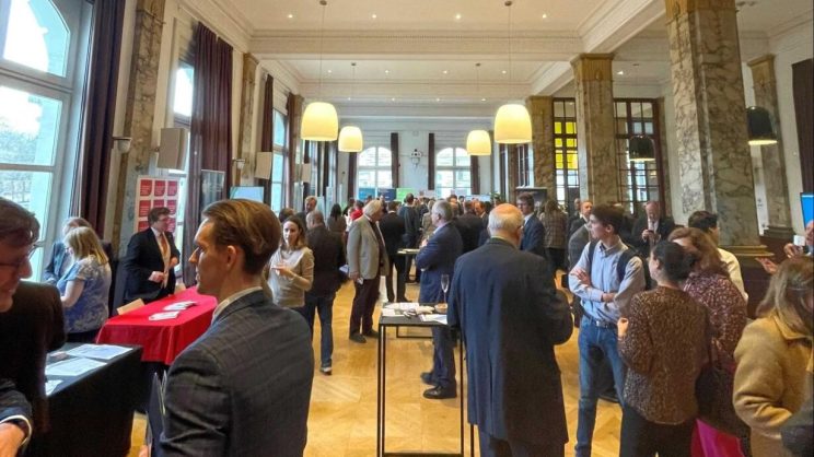 Photo of attendees at the research showcase reception in Brussels